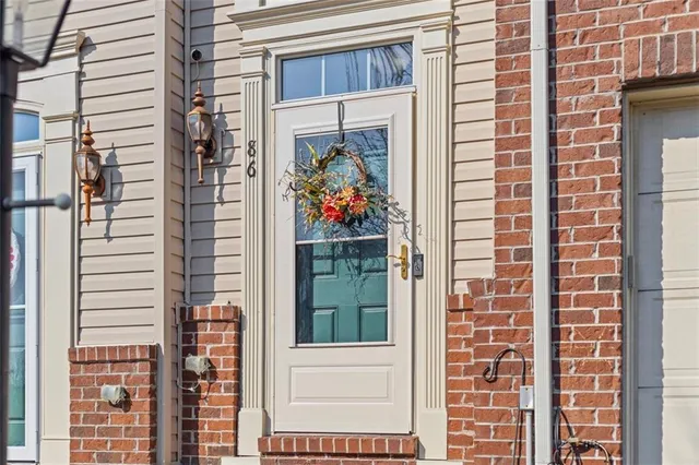 a view of a door and a window of the house