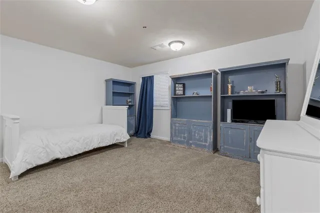 a roof deck with table and chairs