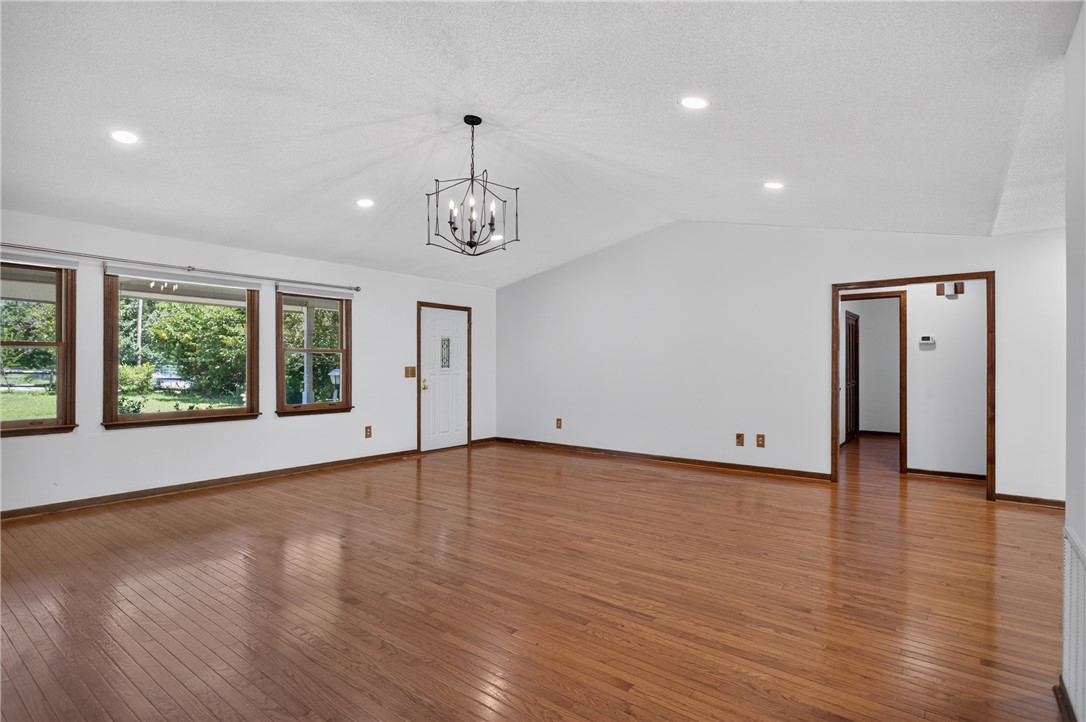 103 Dorsey Lane Walhalla, SC 29691 - Photo 3 of 42 A warm welcome awaits in this spacious room, featuring vaulted ceilings and glossy wood flooring.