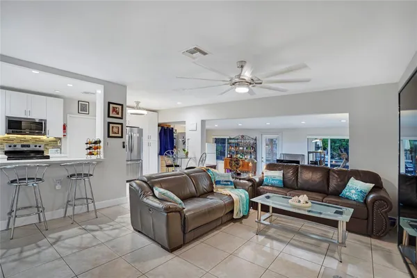 a view of a livingroom with furniture and a flat screen tv
