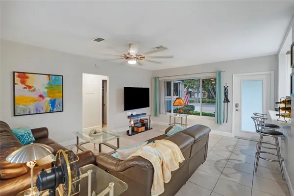 a kitchen with stainless steel appliances a stove microwave and sink