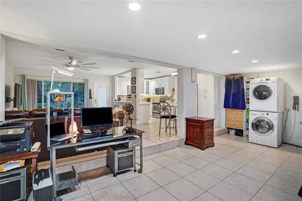 a bedroom with a bed and glass window