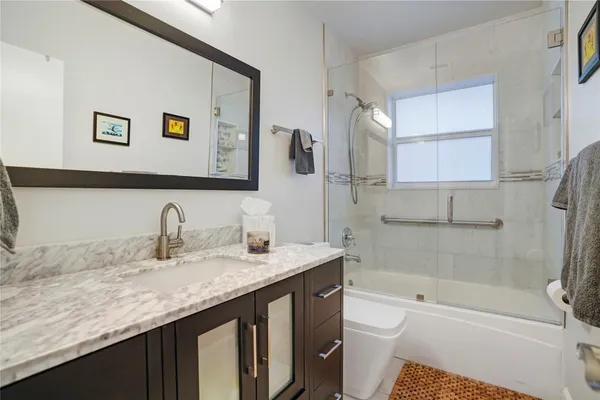 a kitchen with stainless steel appliances a sink a stove and microwave