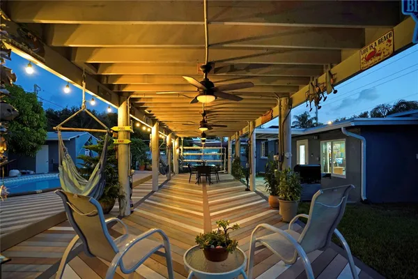 a view of a chairs and tables in a patio