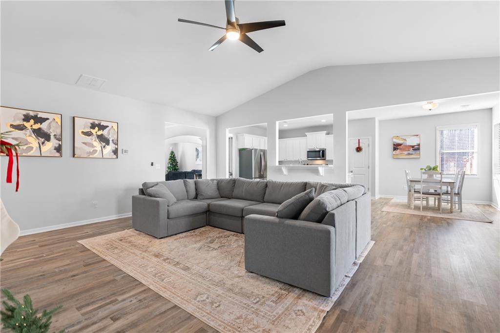 2190 Leatherstone Drive Powder Springs, GA 30127 - Photo 14 of 38 a living room with furniture and a wooden floor