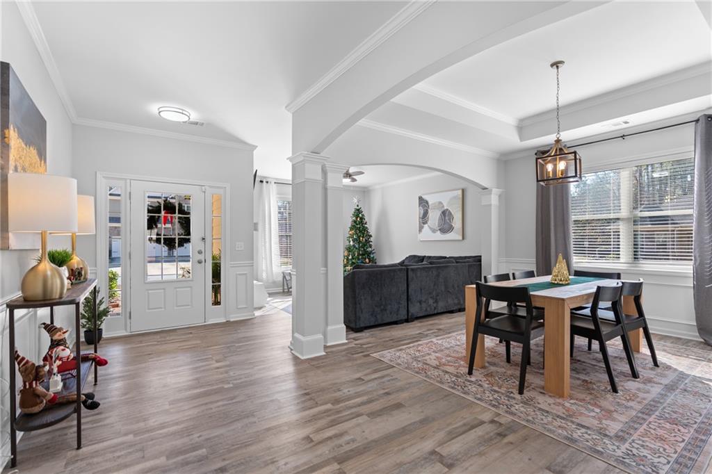 2190 Leatherstone Drive Powder Springs, GA 30127 - Photo 16 of 38 a view of a dining room with furniture and wooden floor