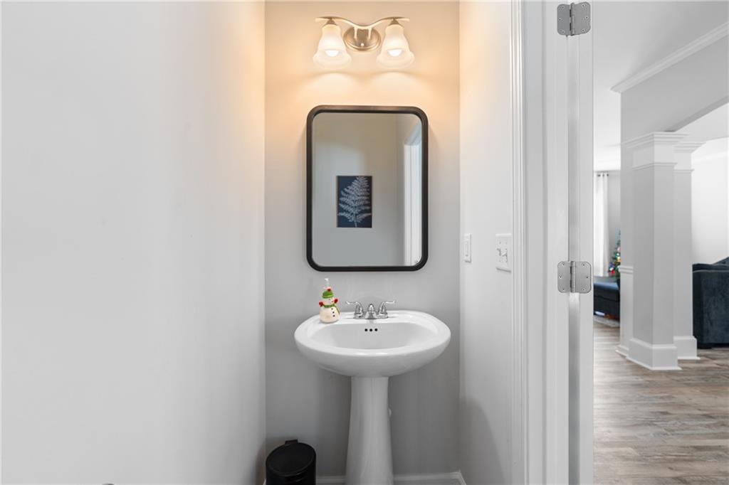 2190 Leatherstone Drive Powder Springs, GA 30127 - Photo 17 of 38 a bathroom with a sink and a mirror