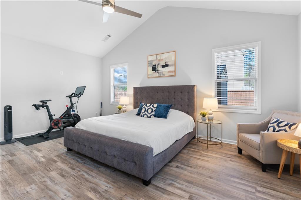 2190 Leatherstone Drive Powder Springs, GA 30127 - Photo 20 of 38 a bedroom with a bed and wooden floor