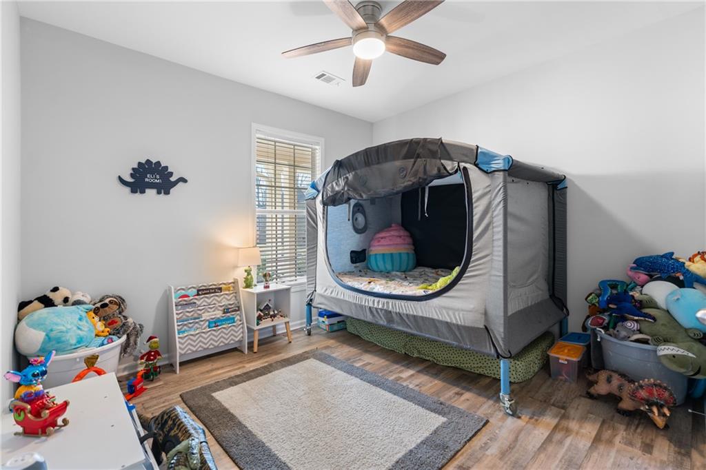 2190 Leatherstone Drive Powder Springs, GA 30127 - Photo 24 of 38 a bedroom with furniture and a window