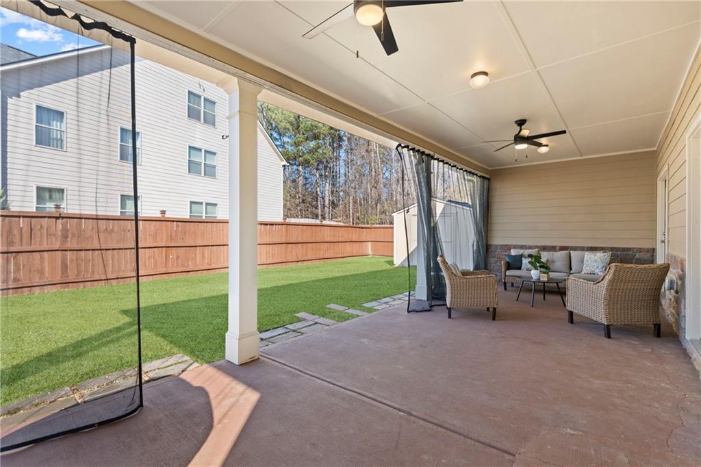 2190 Leatherstone Drive Powder Springs, GA 30127 - Photo 29 of 38 a view of a porch with furniture and backyard