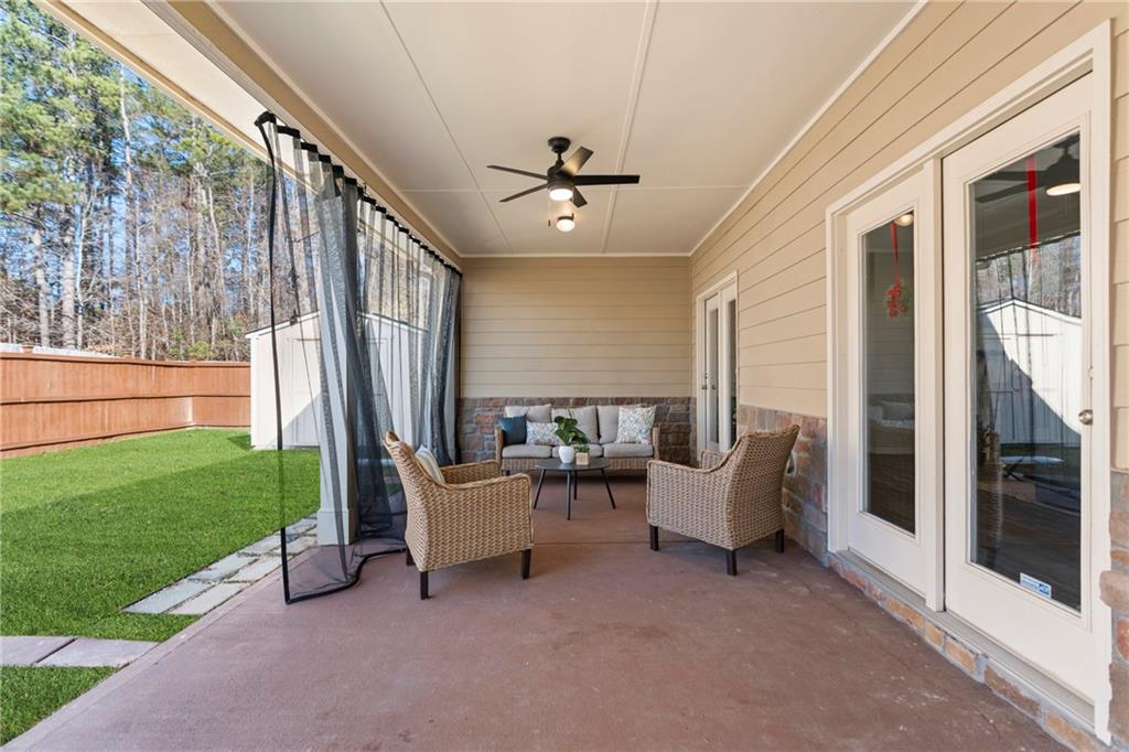 2190 Leatherstone Drive Powder Springs, GA 30127 - Photo 30 of 38 a living room with furniture and a fireplace