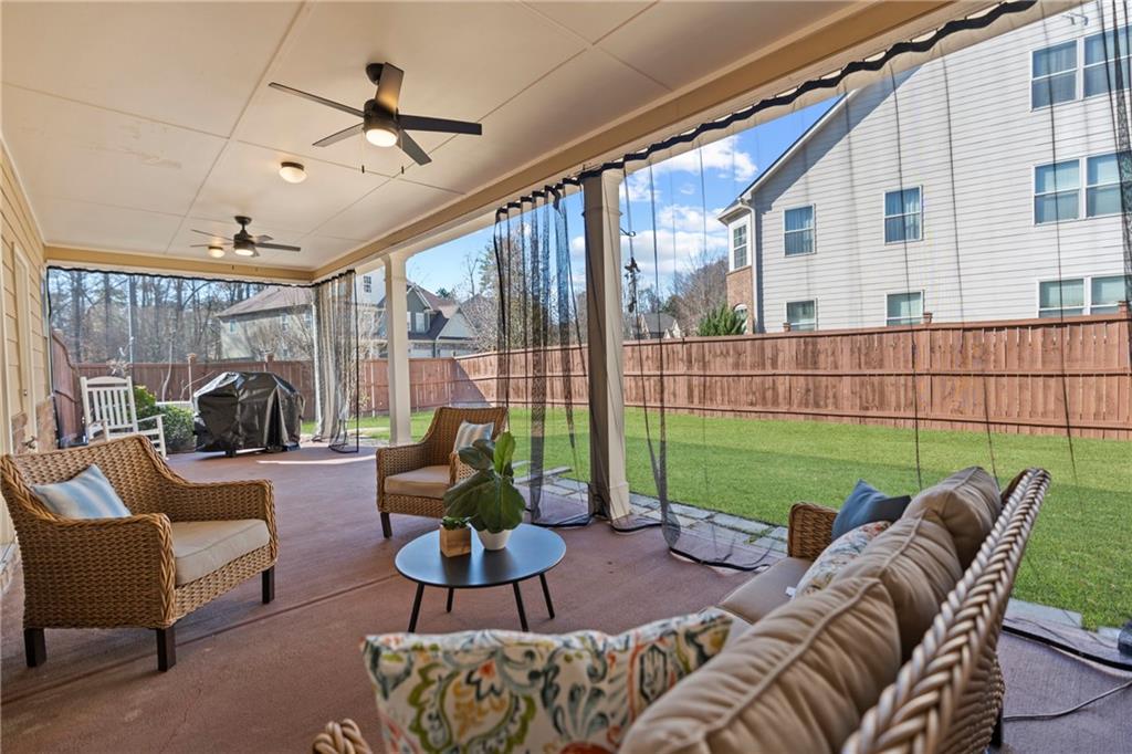 2190 Leatherstone Drive Powder Springs, GA 30127 - Photo 31 of 38 a view of a patio with couches chairs and a potted plant