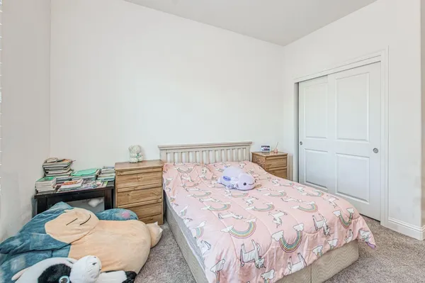 a bedroom with a bed and window