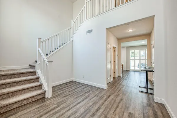 a view of entryway with wooden floor