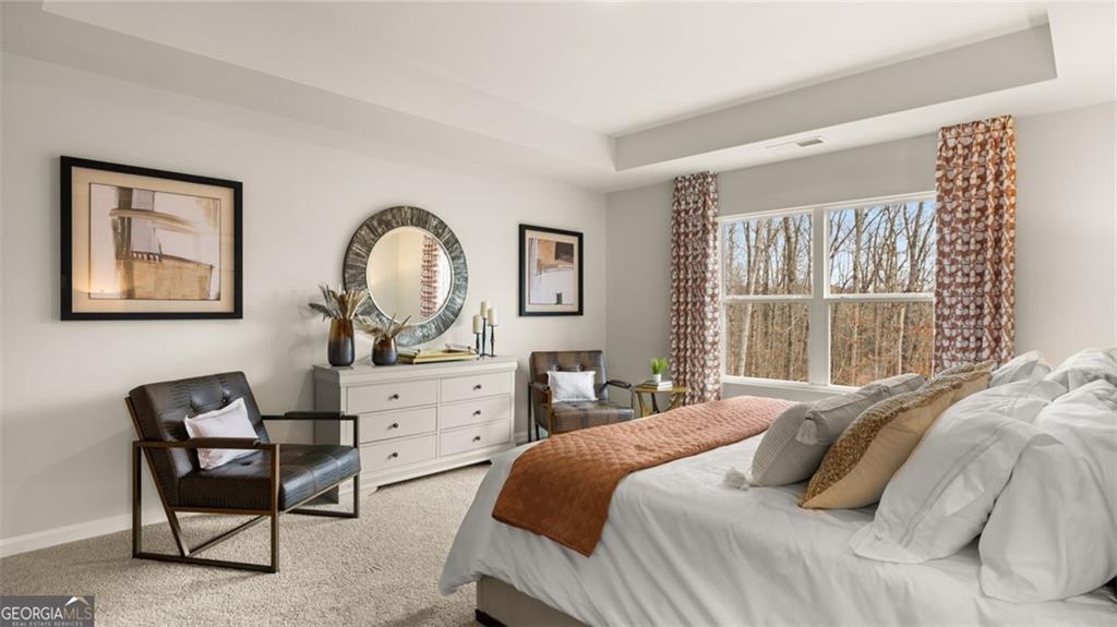 241 Sound Circle Stockbridge, GA 30281 - Photo 47 of 70 a bedroom with a bed chair and a window