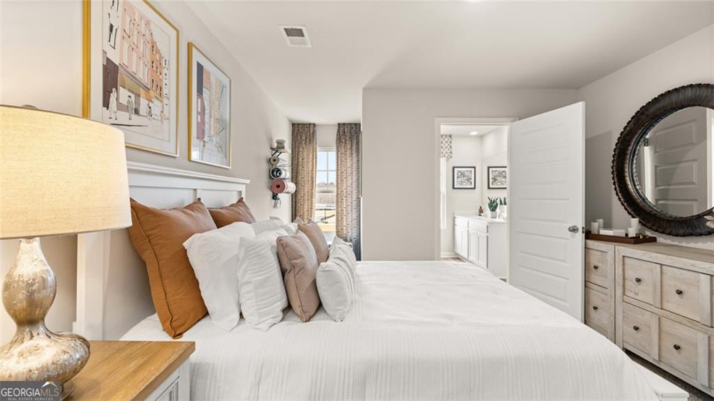 241 Sound Circle Stockbridge, GA 30281 - Photo 58 of 70 a bedroom with a bed and a television