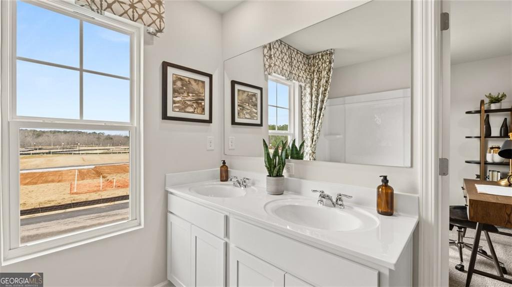 241 Sound Circle Stockbridge, GA 30281 - Photo 66 of 70 a bathroom with a sink and a mirror