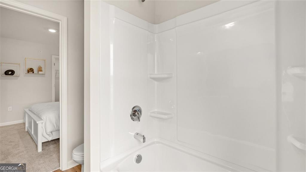 241 Sound Circle Stockbridge, GA 30281 - Photo 69 of 70 a bathroom with a bathtub and shower