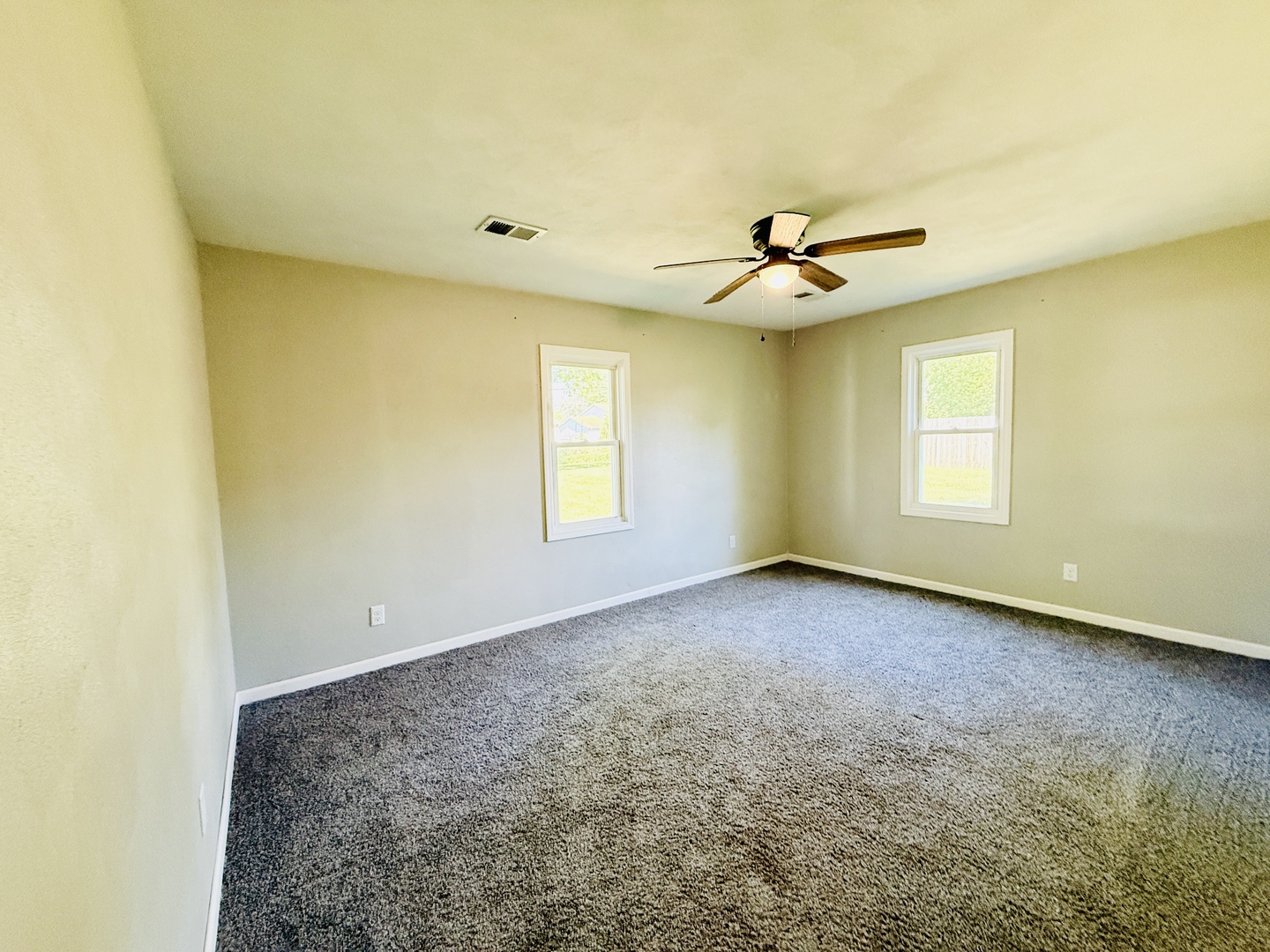 715 8th Street Colona, IL 61241 - Photo 10 of 14 a view of a room with window and ceiling fan