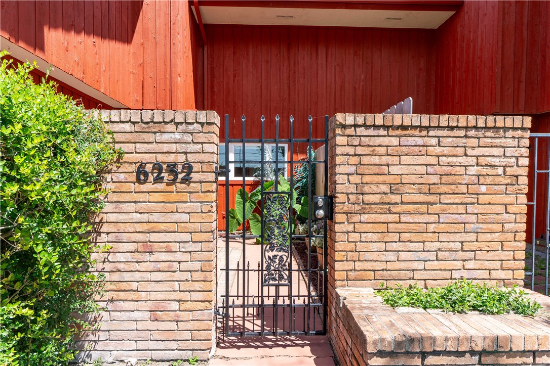 6232 Weber Road Corpus Christi, TX 78413 - Photo 2 of 23 a view of building with yard and staircase