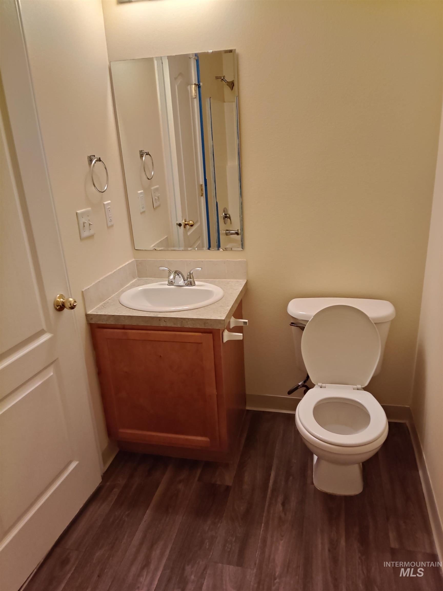 1426 East Sharons Loop Nampa, ID 83686 - Photo 11 of 17 Half bath with vanity and dark wood finished floors