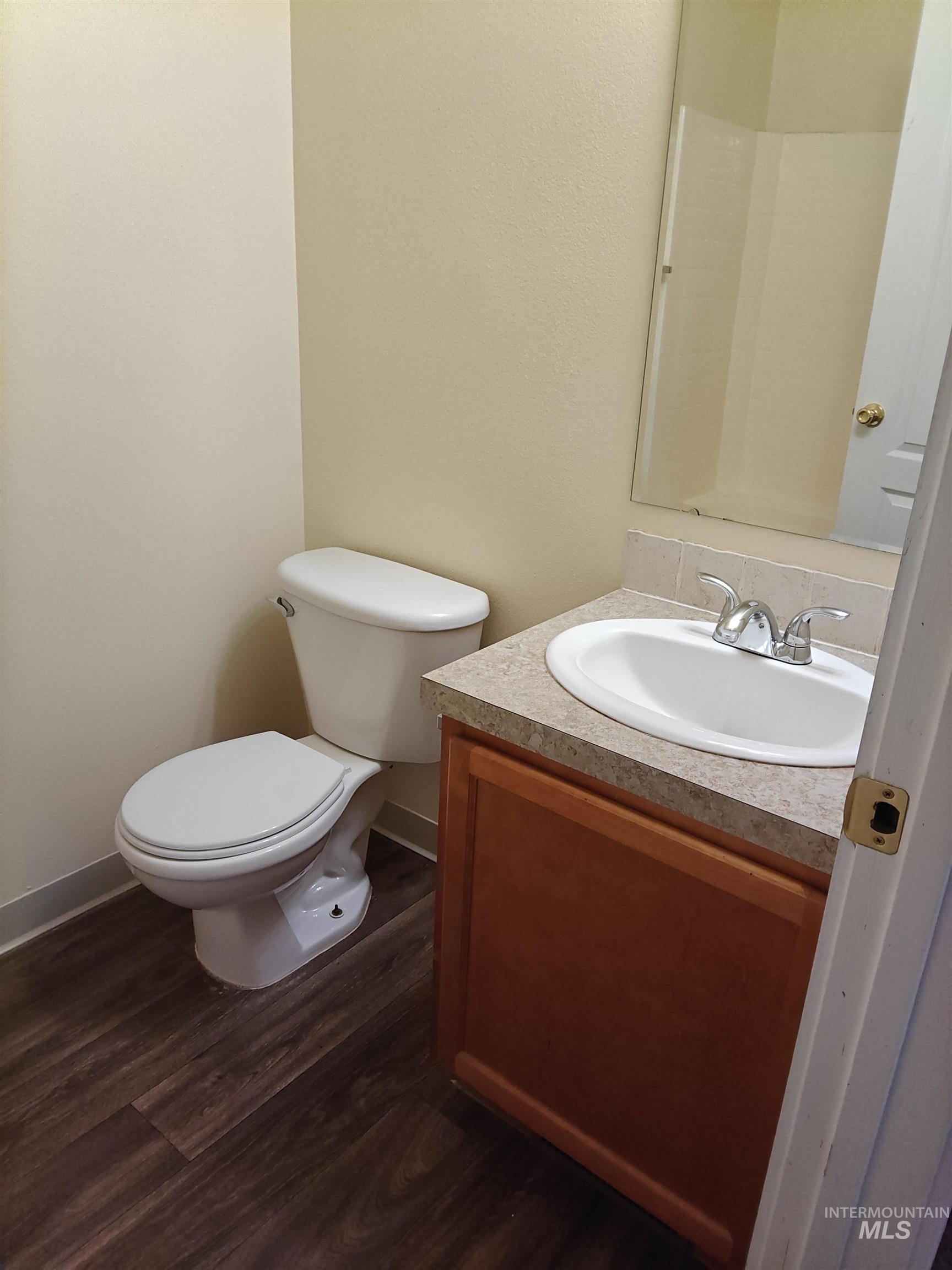 1426 East Sharons Loop Nampa, ID 83686 - Photo 17 of 17 Bathroom with dark wood-style flooring and vanity