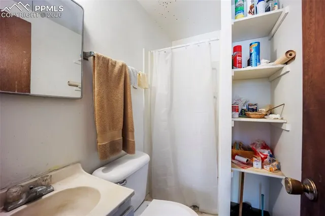 a bathroom with a toilet and a sink