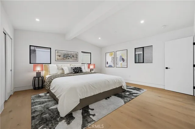 a bed room with a bed and a night stand