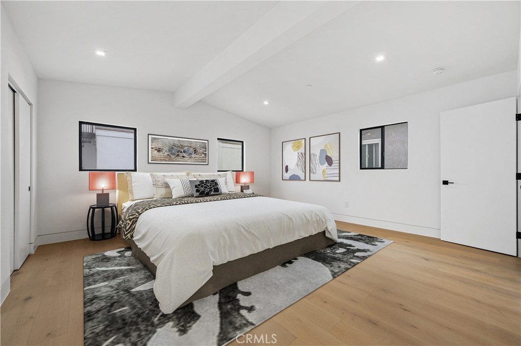 121 39th Street, Unit B Newport Beach, CA 92663 - Photo 12 of 26 a bed room with a bed and a night stand