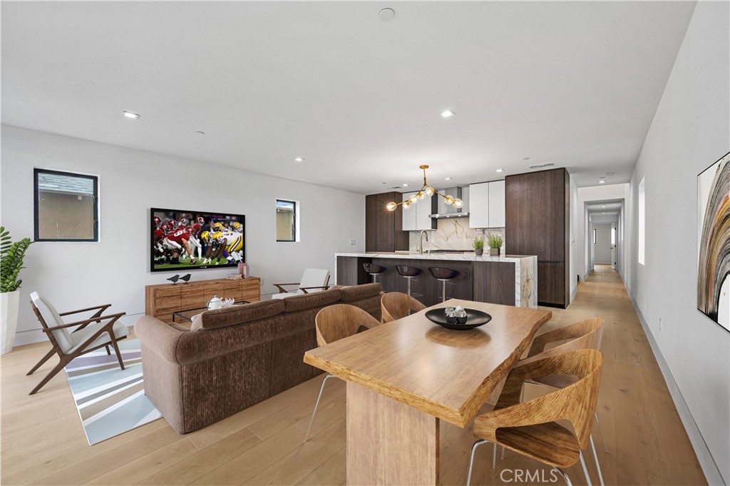 121 39th Street, Unit B Newport Beach, CA 92663 - Photo 3 of 26 a view of a dining room with furniture and a flat screen tv