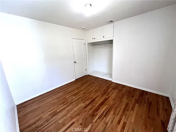 a bathroom with a sink vanity mirror and toilet