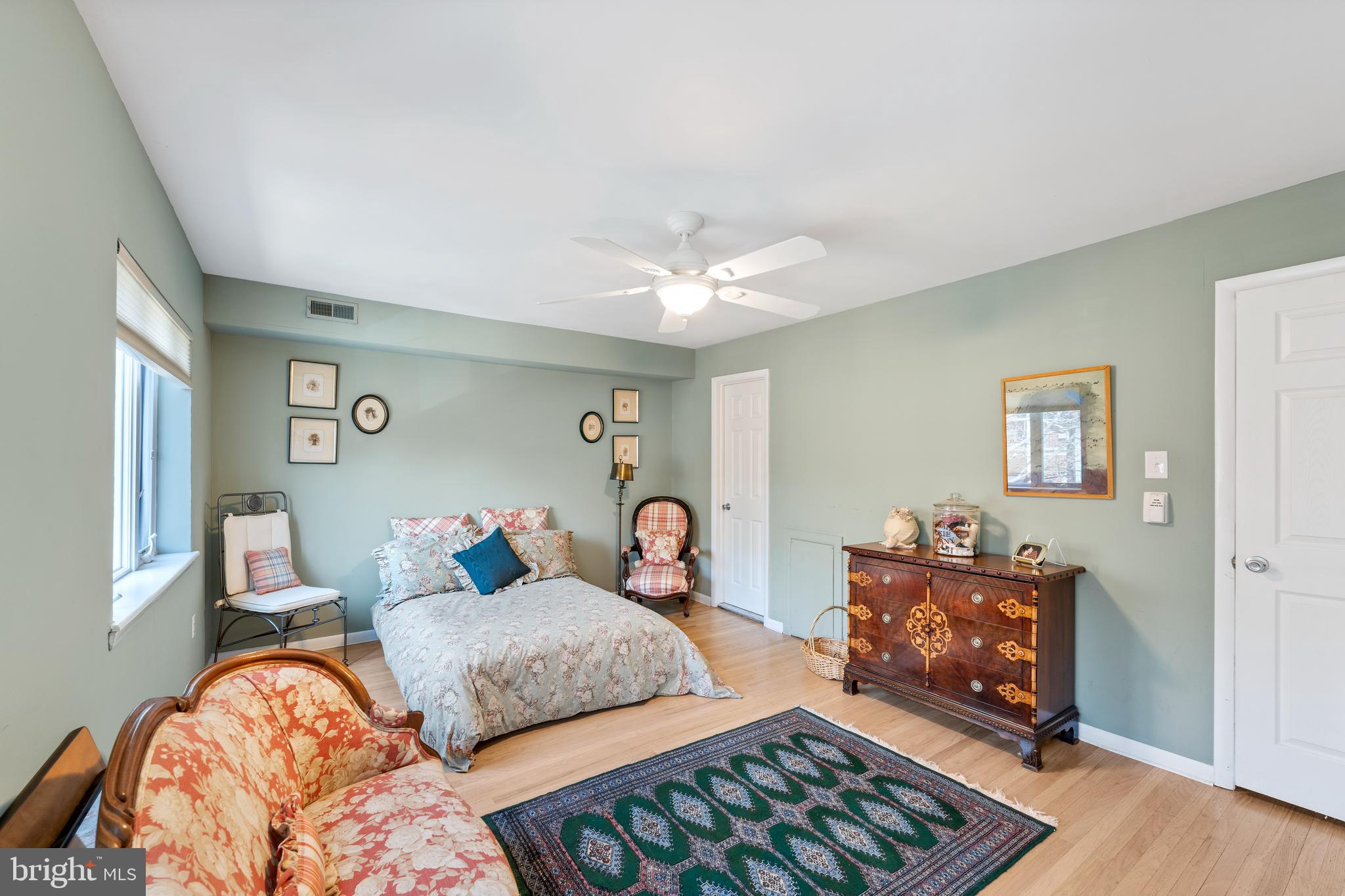 1 Christian Street, Unit 8 Philadelphia, PA 19147 - Photo 12 of 17 a bedroom with furniture and wooden floor
