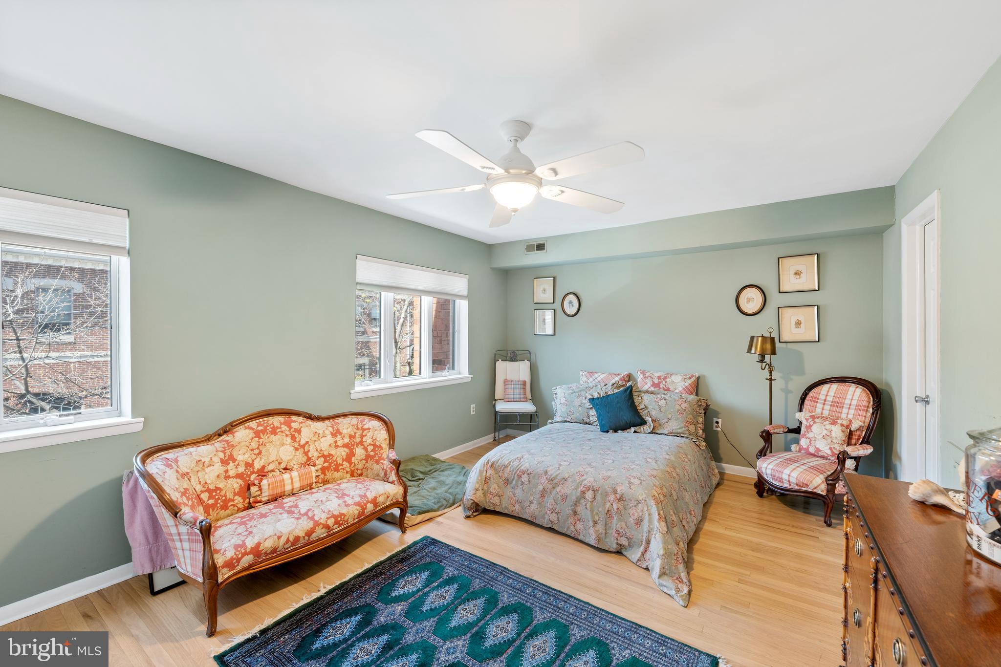 1 Christian Street, Unit 8 Philadelphia, PA 19147 - Photo 13 of 17 a bedroom with two beds and a large window