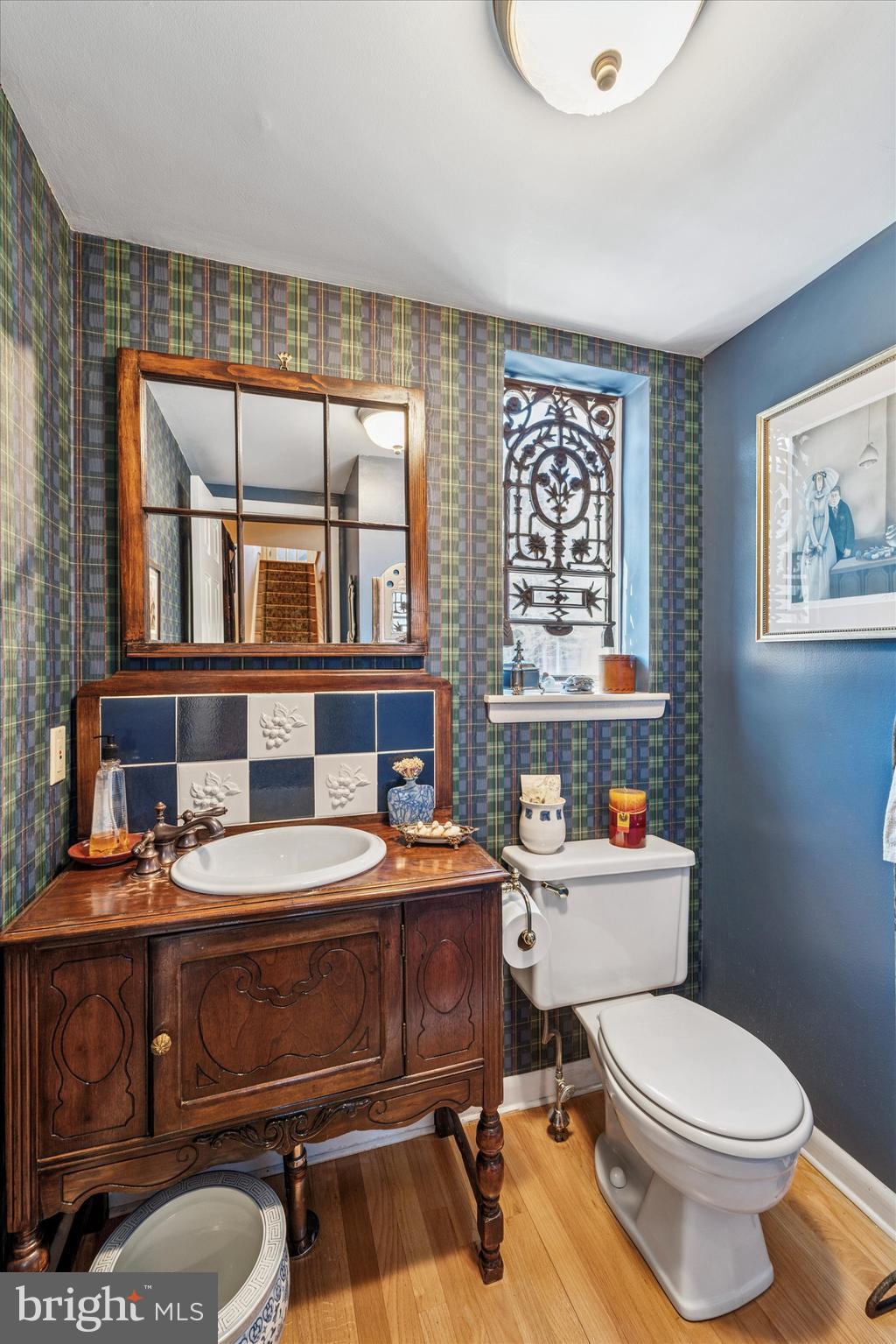 1 Christian Street, Unit 8 Philadelphia, PA 19147 - Photo 7 of 17 a bathroom with a sink toilet and mirror