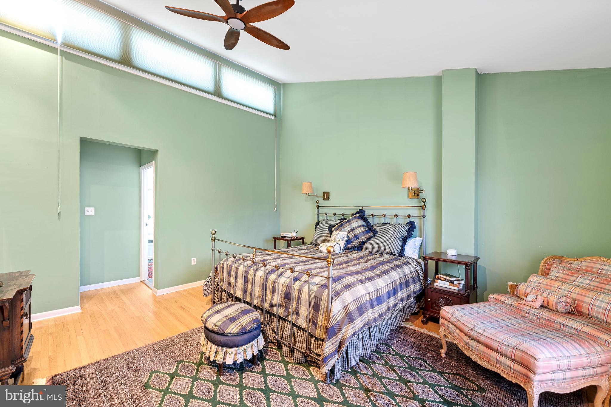 1 Christian Street, Unit 8 Philadelphia, PA 19147 - Photo 8 of 17 a bedroom with a bed and ceiling fan