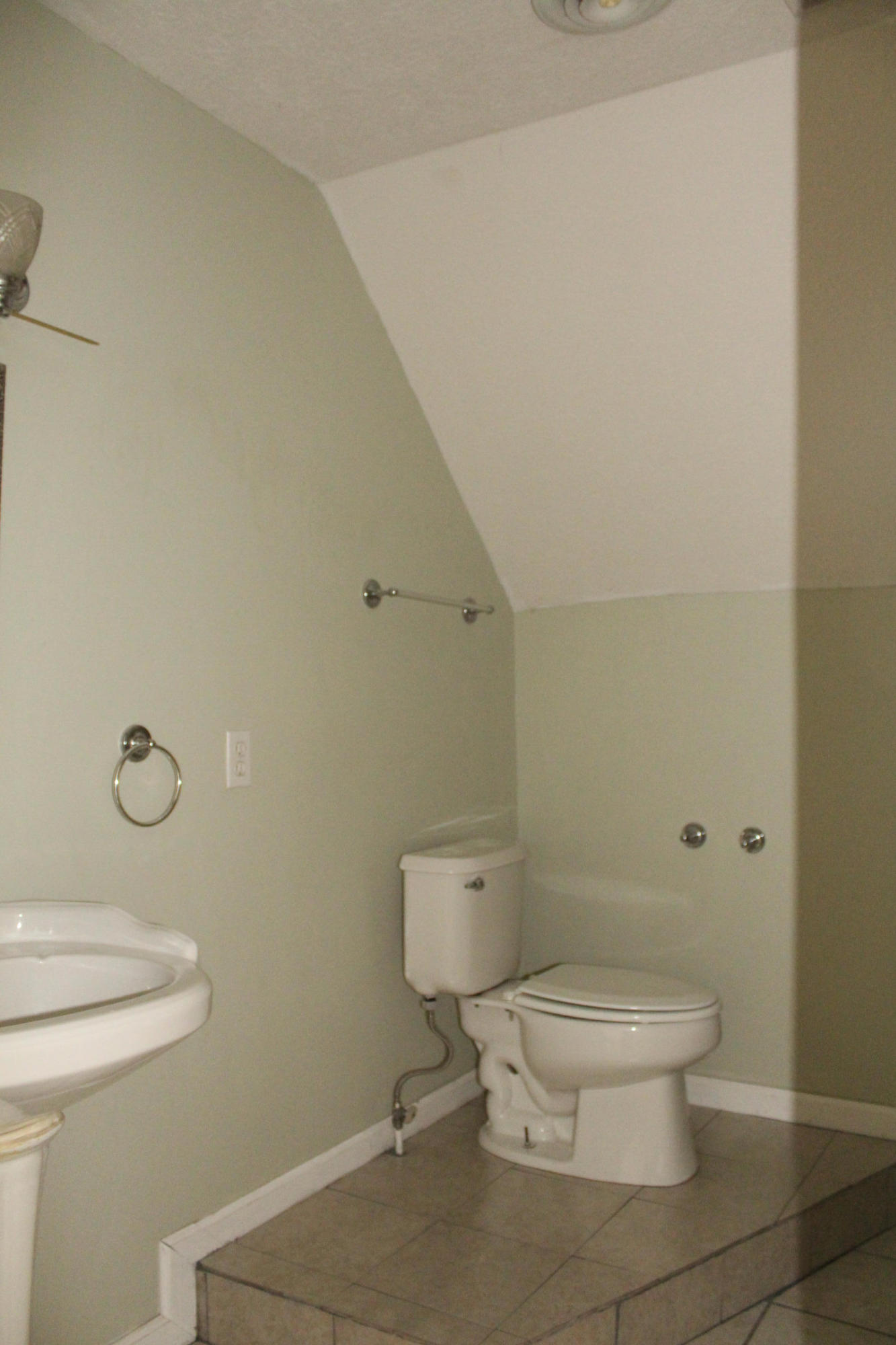 2670 Old Rte 100 Draper, VA 24324 - Photo 21 of 37 a white toilet sitting next to a bathroom sink