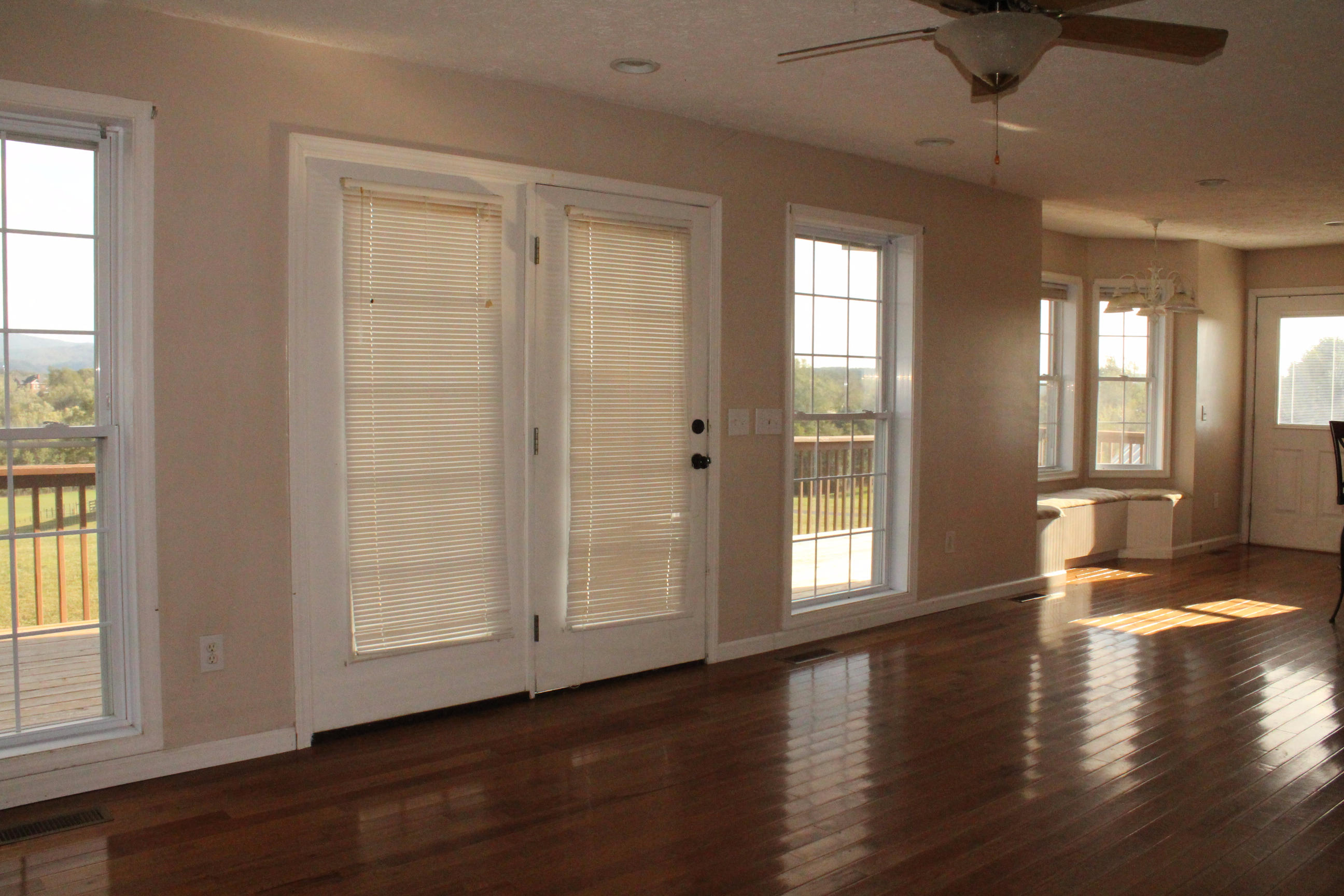 2670 Old Rte 100 Draper, VA 24324 - Photo 5 of 37 a view of an empty room with wooden floor and a window