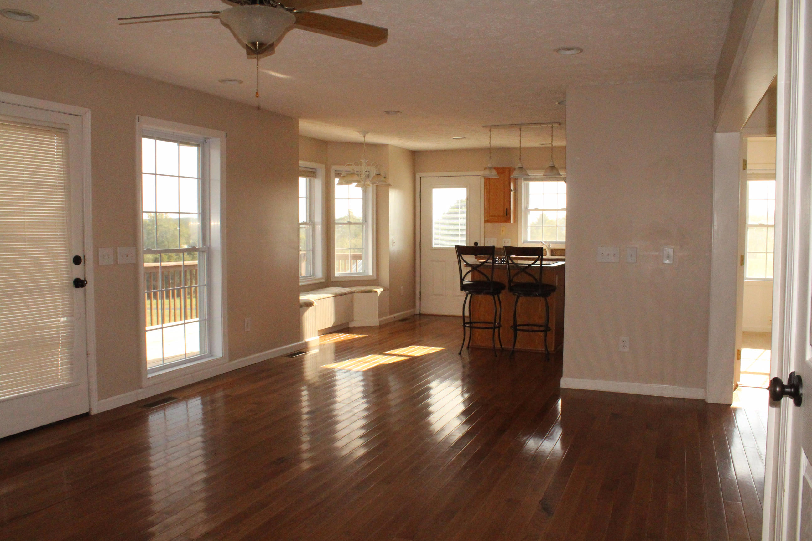 2670 Old Rte 100 Draper, VA 24324 - Photo 7 of 37 an empty room with wooden floor and windows