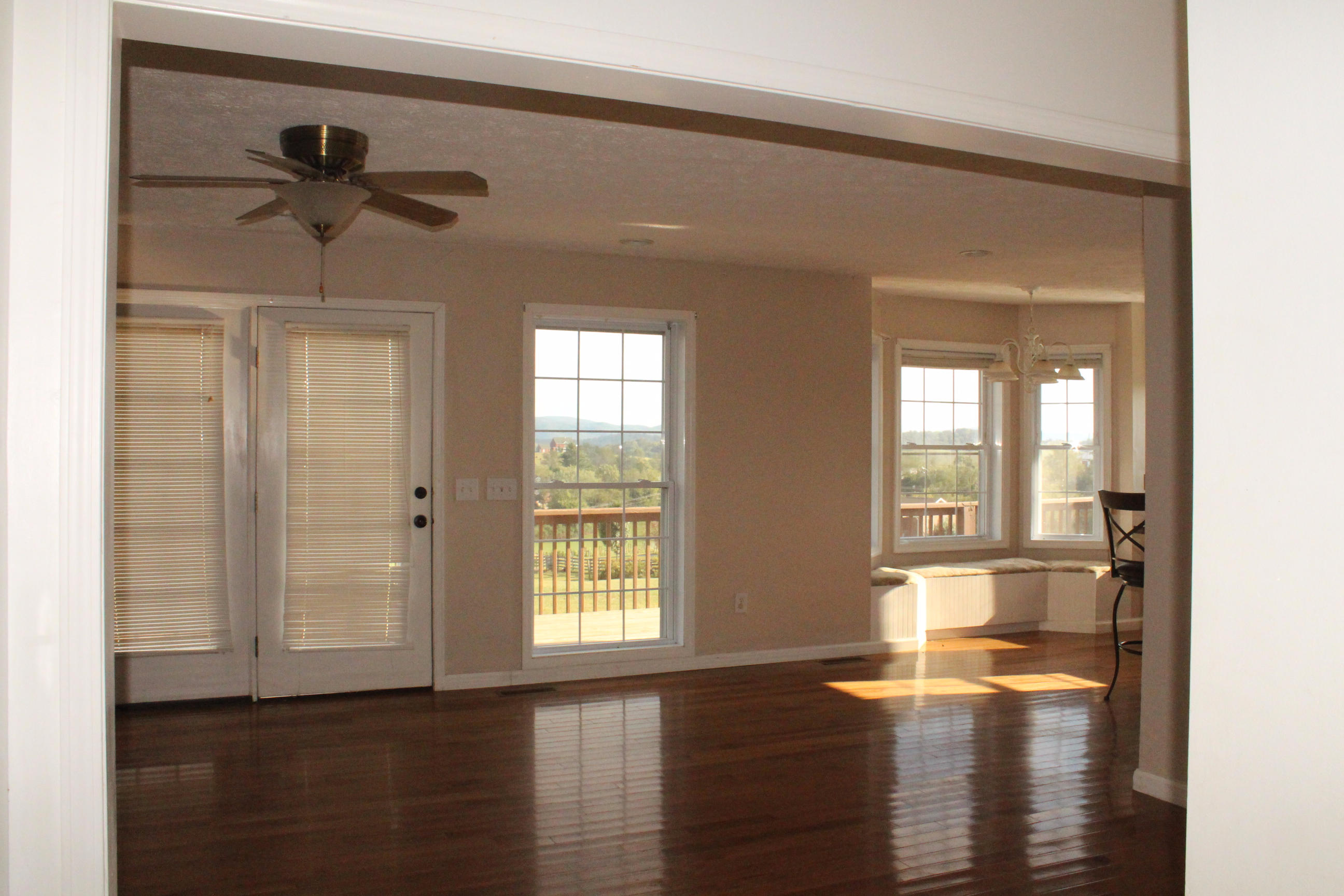 2670 Old Rte 100 Draper, VA 24324 - Photo 8 of 37 a view of empty room with wooden floor and fan