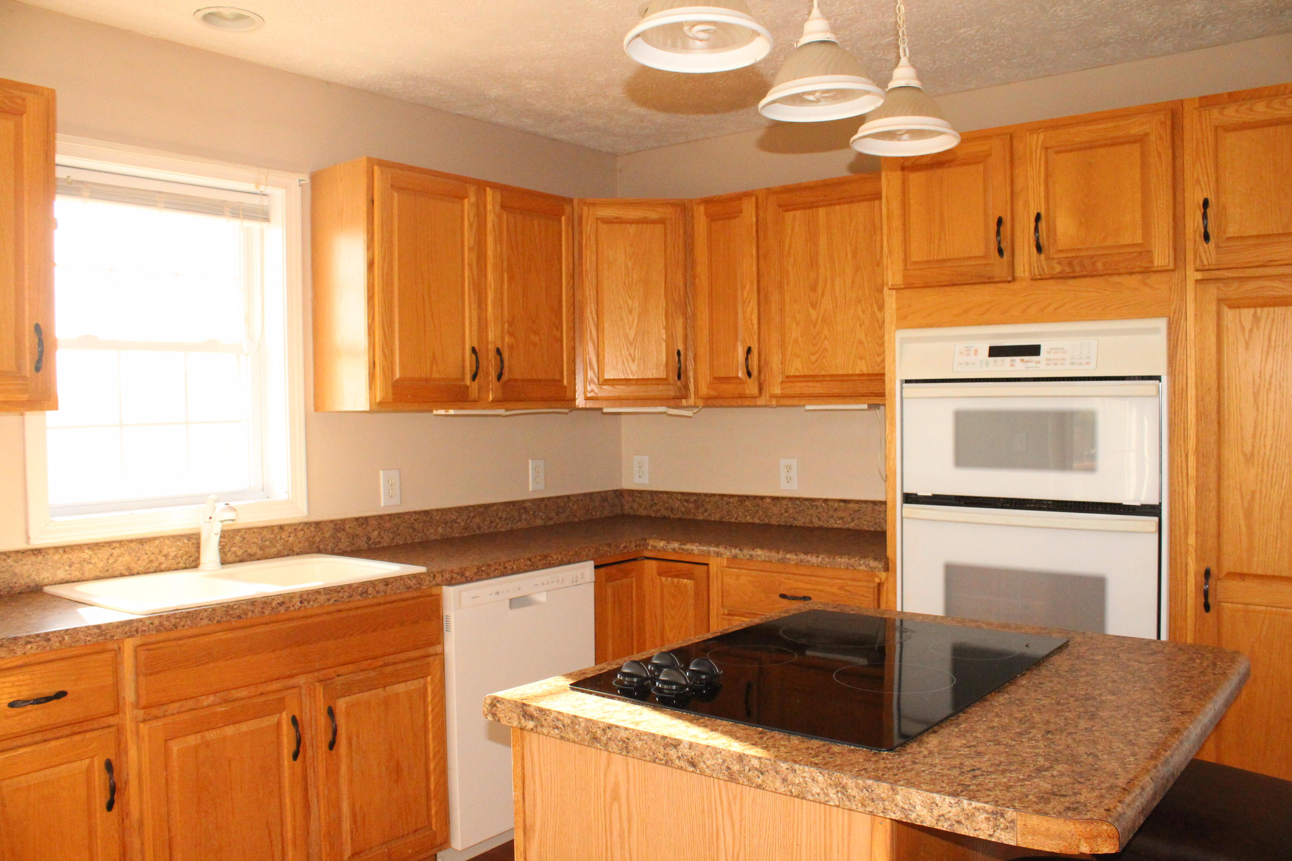 2670 Old Rte 100 Draper, VA 24324 - Photo 9 of 37 a kitchen with a sink a stove and cabinets