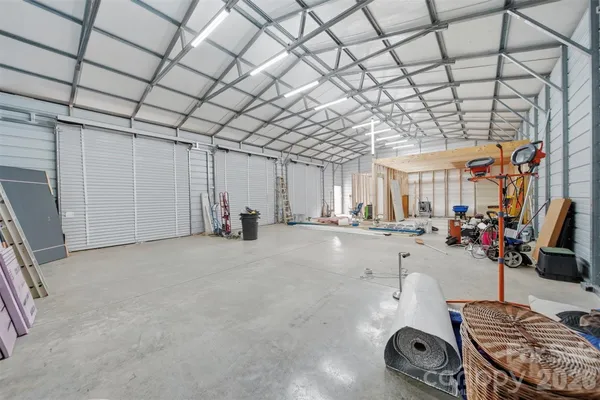 a room with gym equipment and a mirror