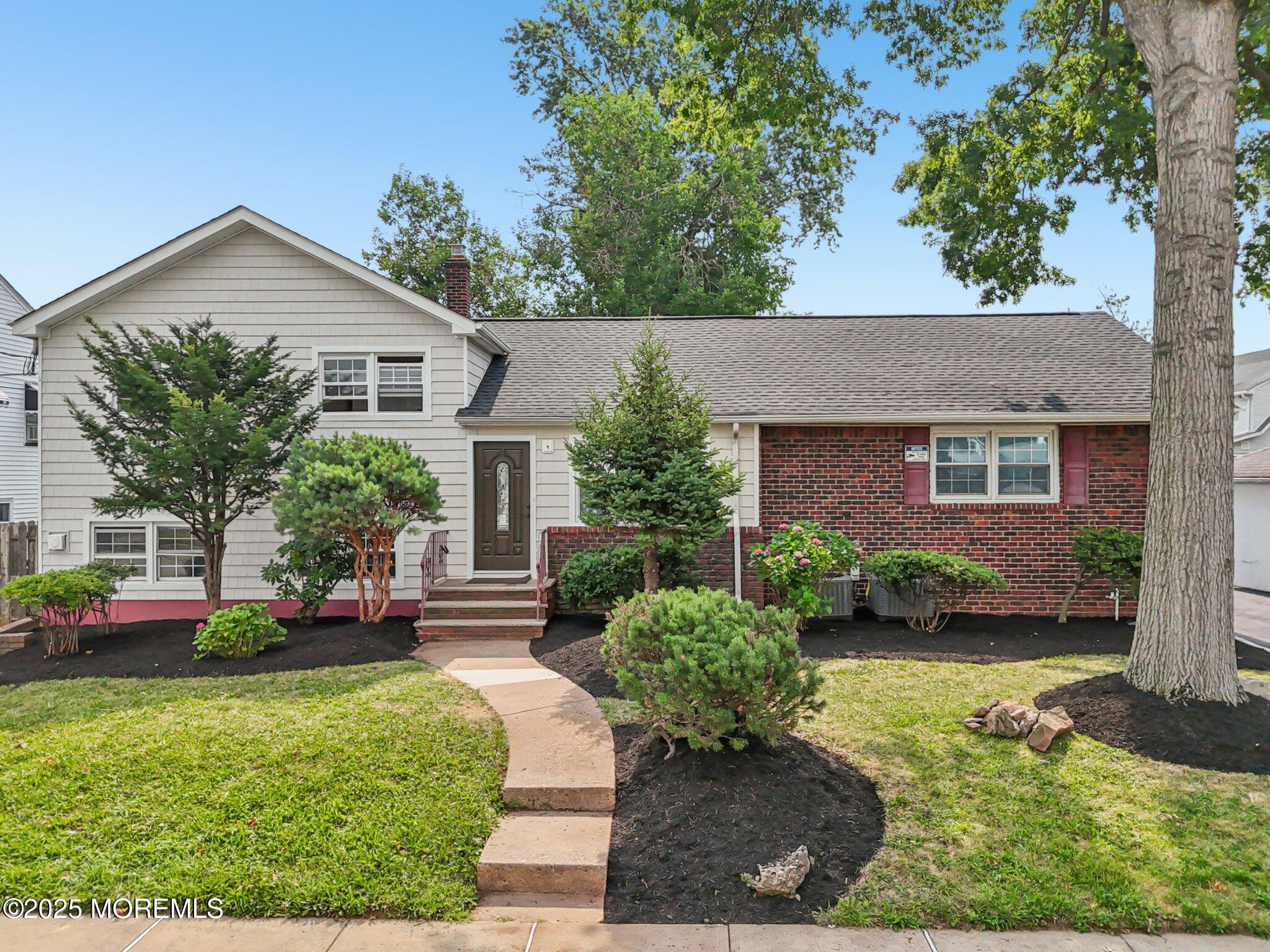 26 Fillmore Avenue Carteret, NJ 07008 - Photo 1 of 60 a front view of a house with a yard