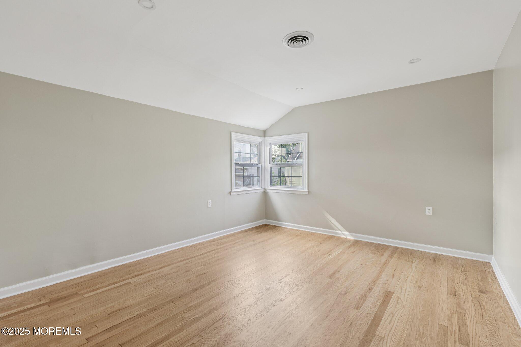 26 Fillmore Avenue Carteret, NJ 07008 - Photo 12 of 60 wooden floor in an empty room with a window