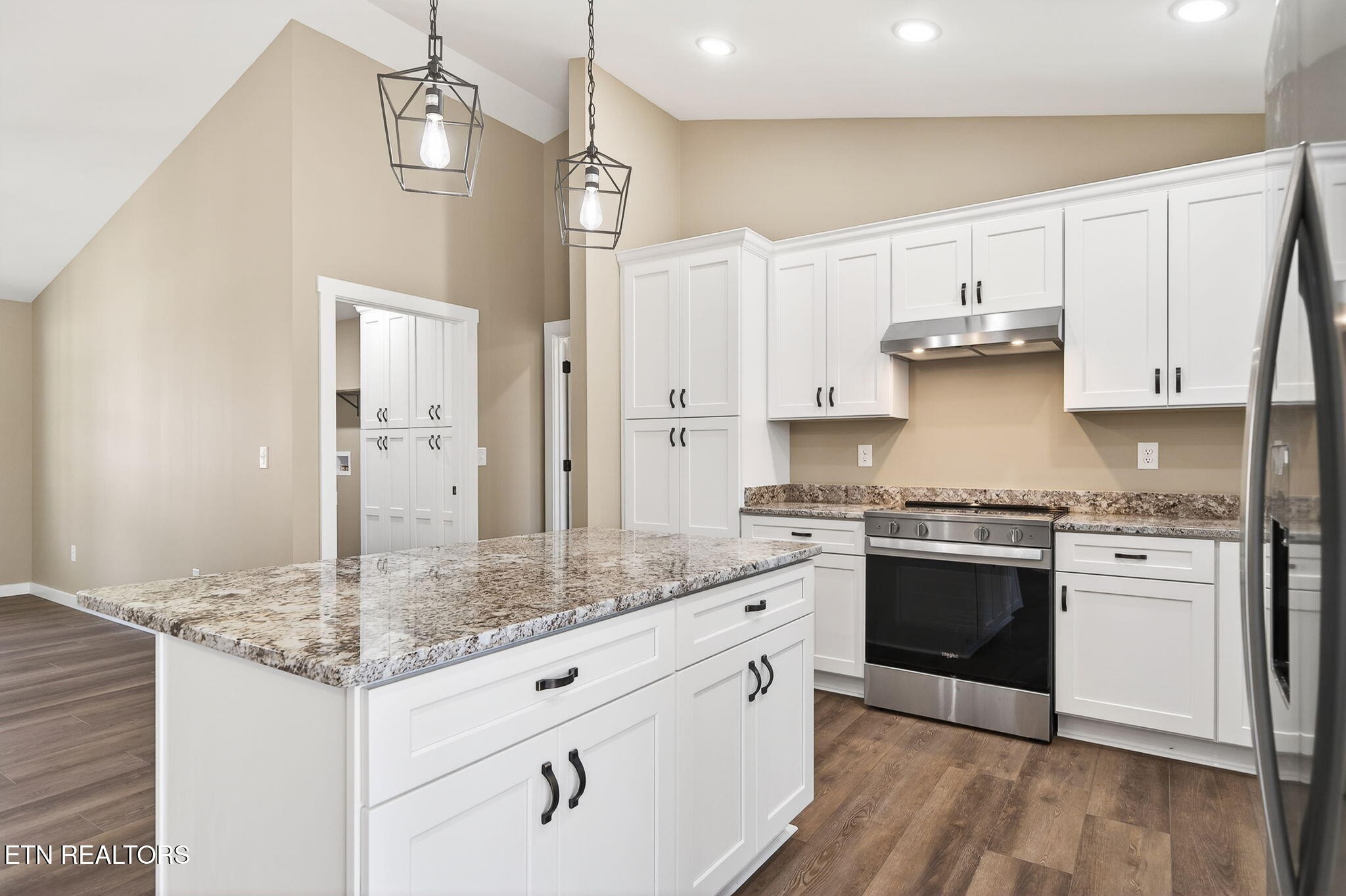 105 Peebles Road Crossville, TN 38558 - Photo 12 of 40 a kitchen with stainless steel appliances granite countertop a stove and a sink