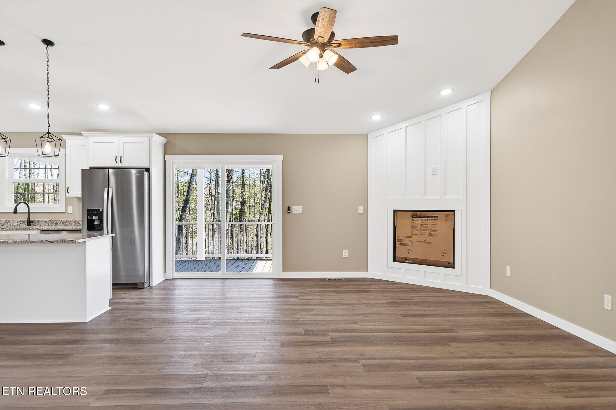 105 Peebles Road Crossville, TN 38558 - Photo 15 of 40 a view of an empty room with a window and wooden floor