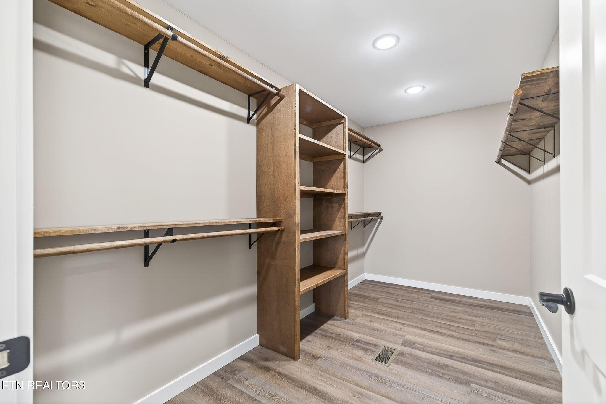 105 Peebles Road Crossville, TN 38558 - Photo 18 of 40 a view of walk in closet with empty racks