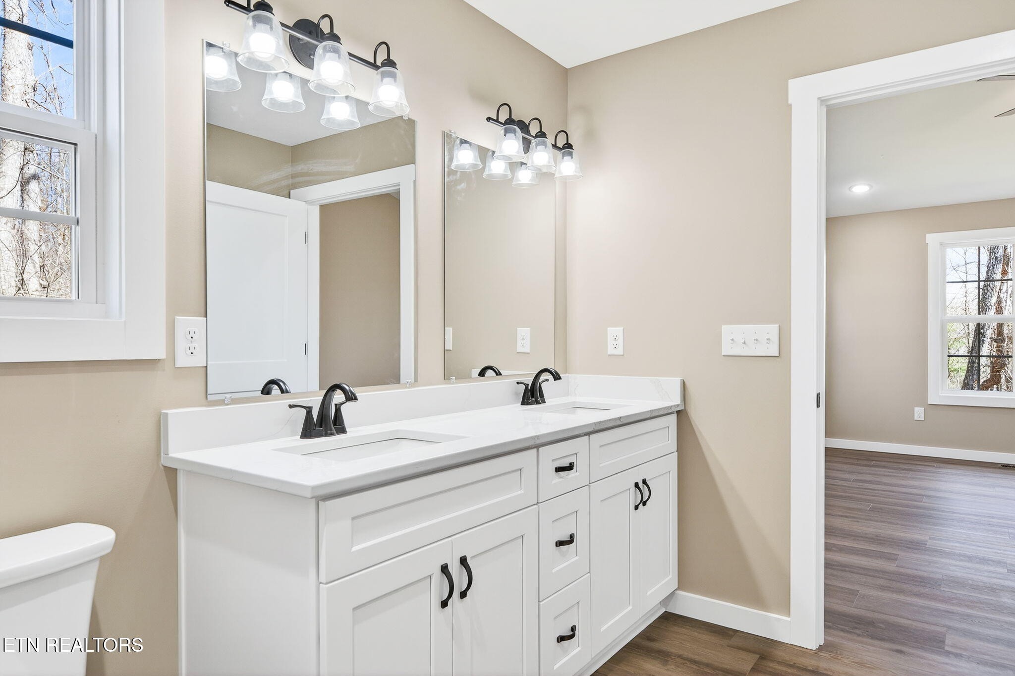 105 Peebles Road Crossville, TN 38558 - Photo 19 of 40 a bathroom with a double vanity sink mirror and