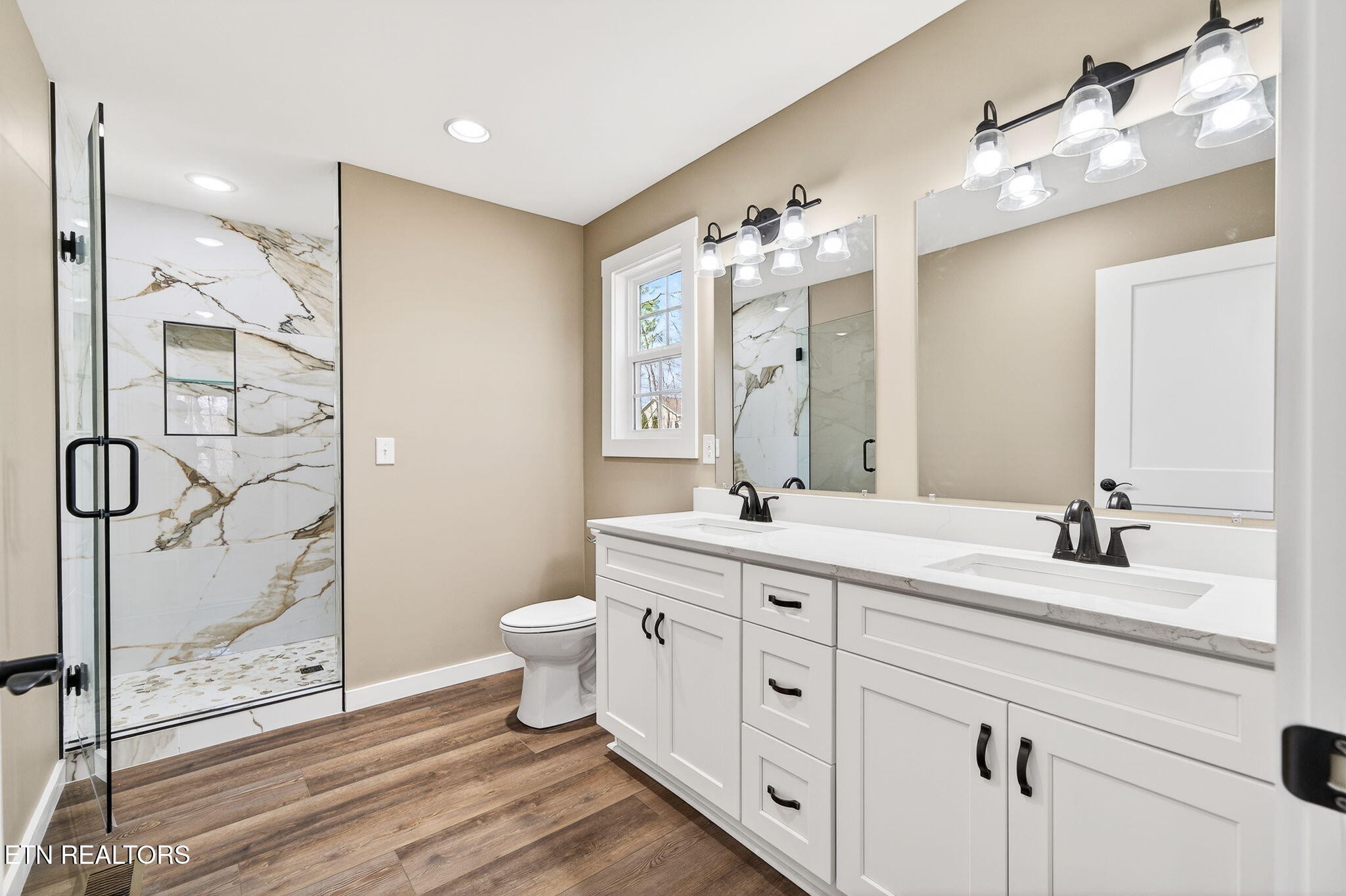 105 Peebles Road Crossville, TN 38558 - Photo 20 of 40 a bathroom with a double vanity sink mirror and toilet