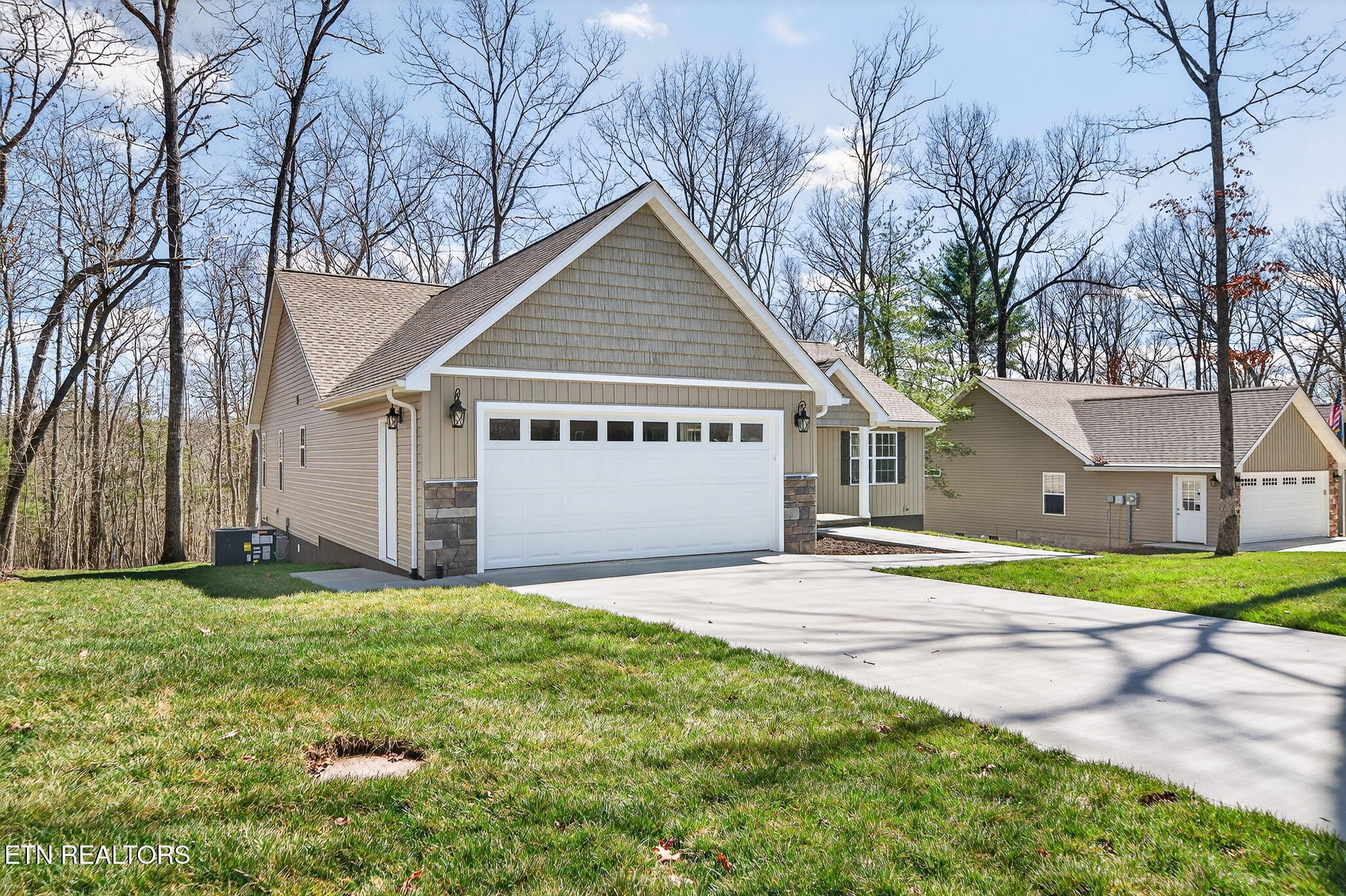105 Peebles Road Crossville, TN 38558 - Photo 30 of 40 a view of a house with a yard and large trees