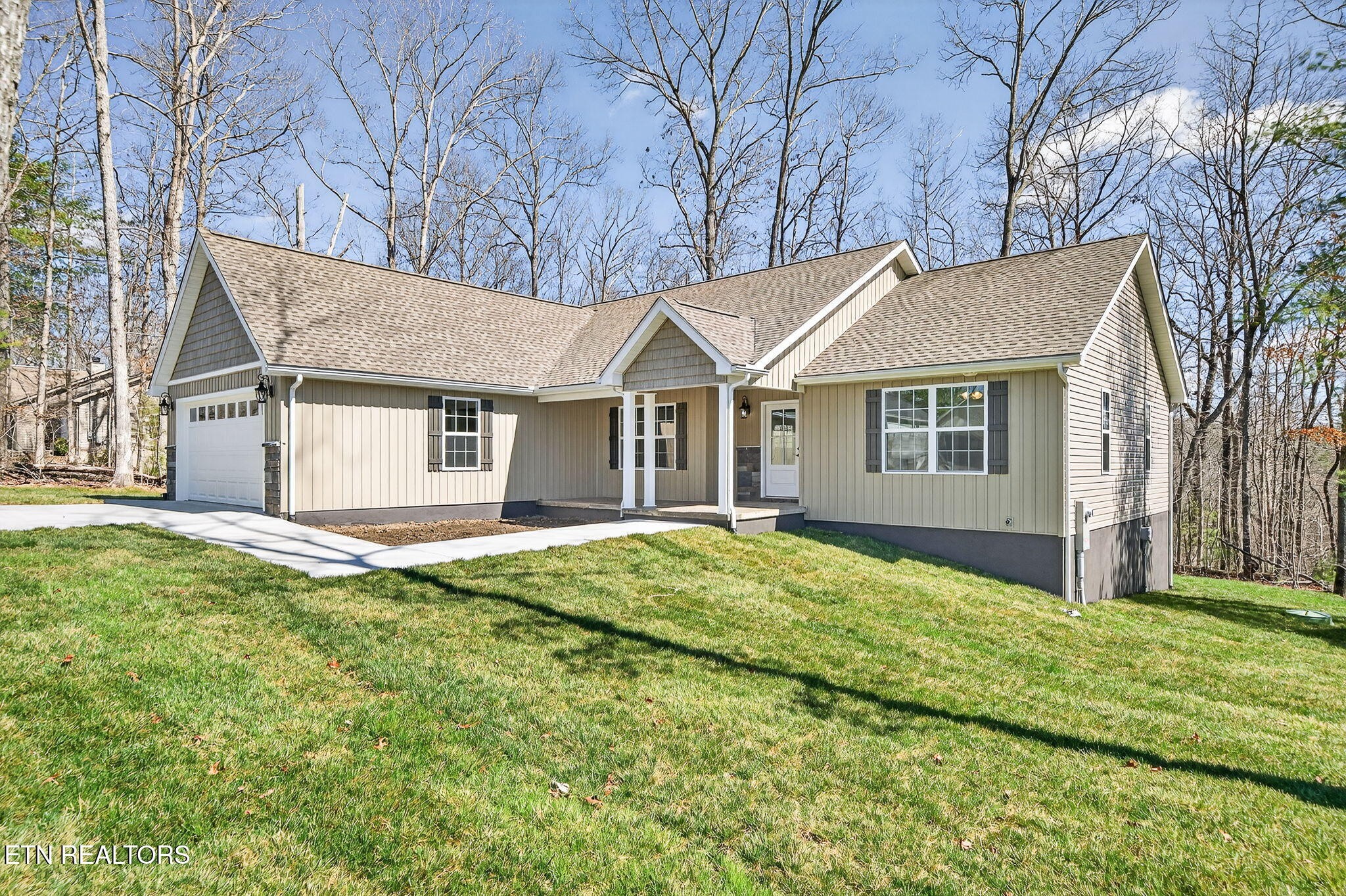 105 Peebles Road Crossville, TN 38558 - Photo 31 of 40 a view of a yard in front of a house with large tree